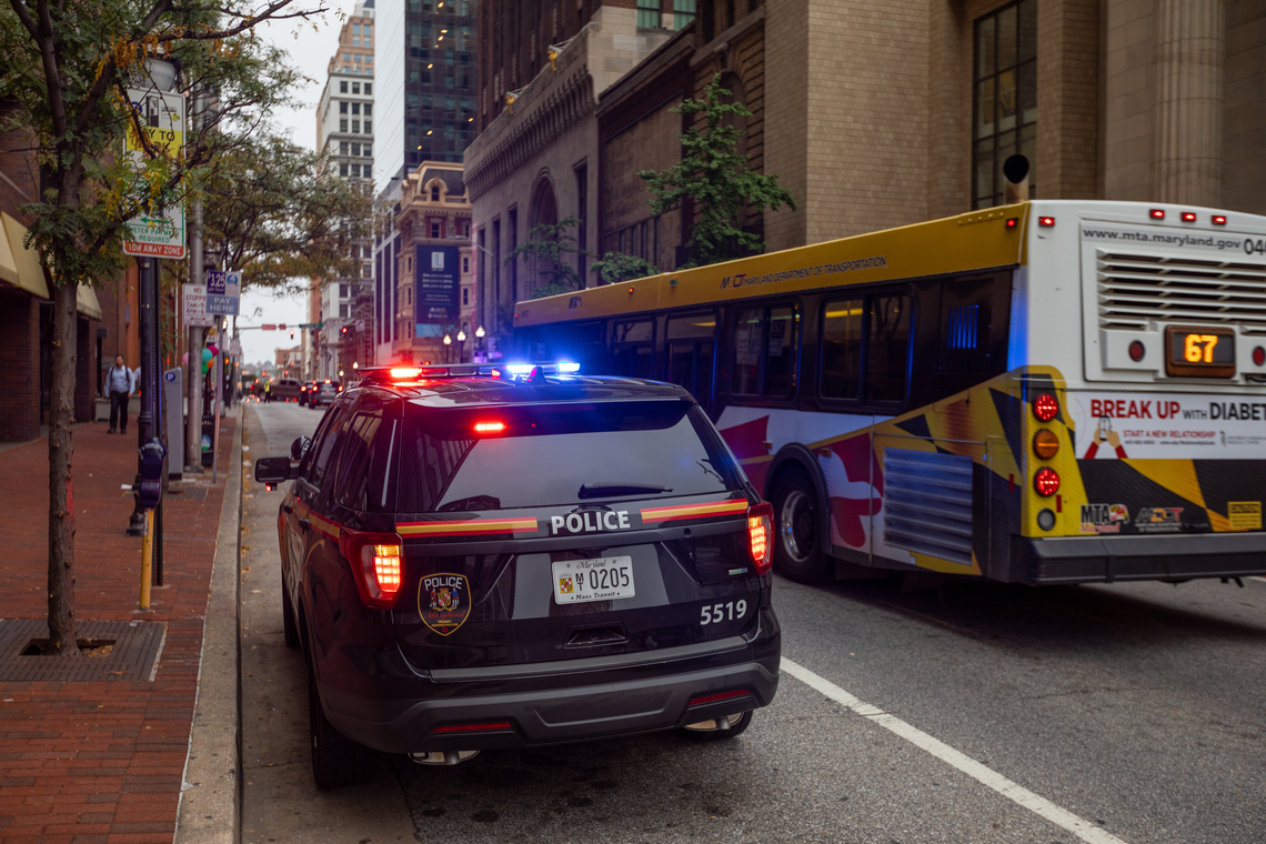 Politiewagen in de straten van Baltimore. Foto Shutterstock